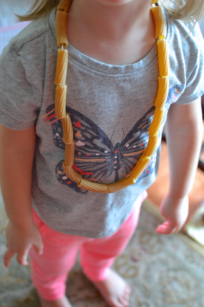 Threading with Noodles - Use pasta noodles like beads for threading in this activity to help strengthen children's fine motor skills! ~sweetpeasandabcs.com