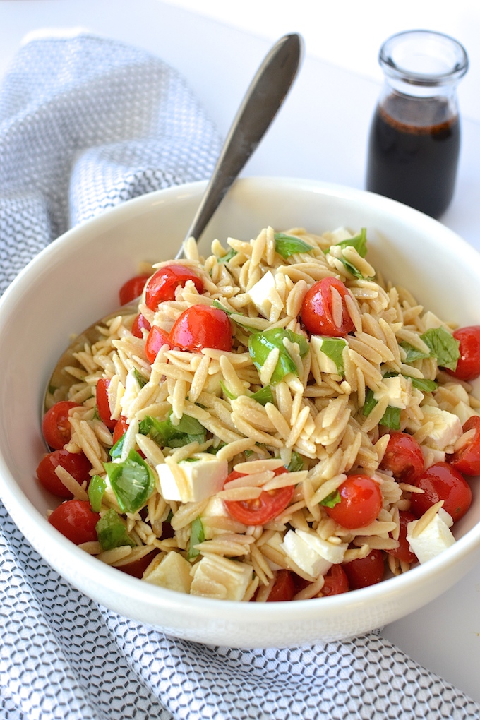 Caprese Orzo Salad with Balsamic Syrup - Fresh mozzarella, juicy tomatoes, garden basil and orzo pasta drizzled with a sweet balsamic syrup...perfect for a weekday lunch or as a side at your summer BBQ! ~sweetpeasandabcs.com