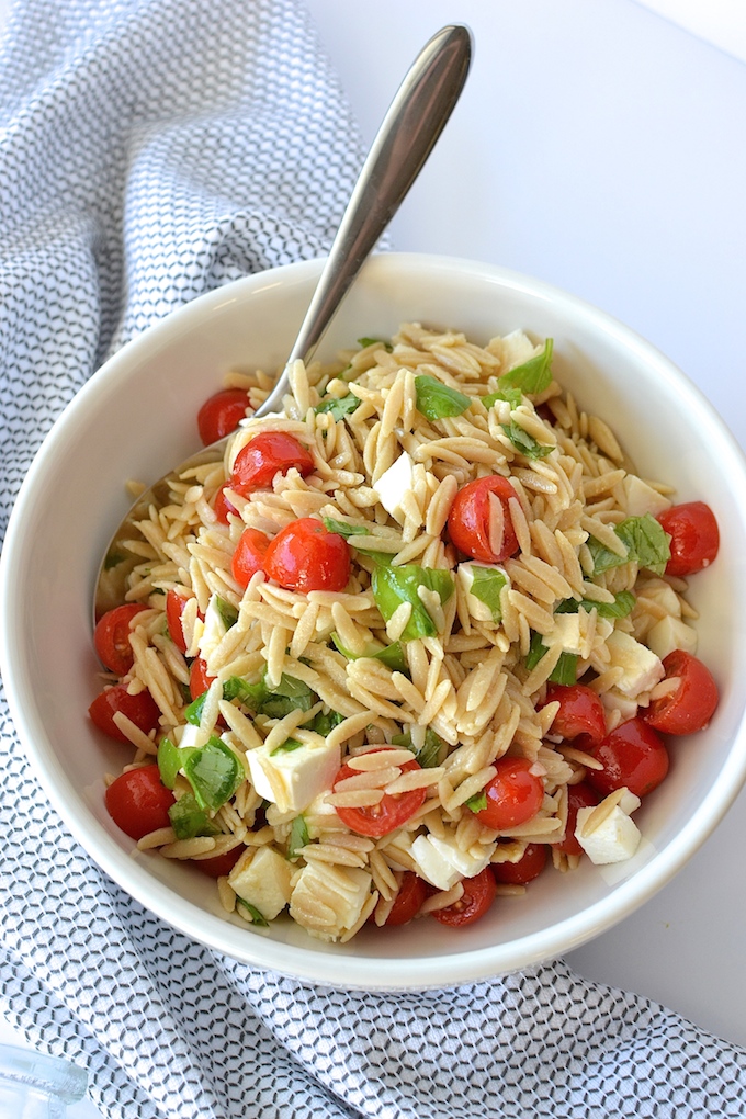 Caprese Orzo Salad with Balsamic Syrup - Fresh mozzarella, juicy tomatoes, garden basil and orzo pasta drizzled with a sweet balsamic syrup...perfect for a weekday lunch or as a side at your summer BBQ! ~sweetpeasandabcs.com