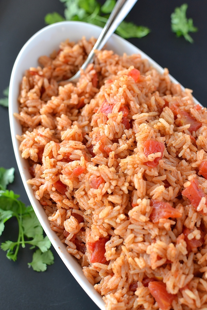 Simple Spanish Rice - Flavored with simple spices and tomatoes, this Simple Spanish Rice recipe is a perfect side dish for any dinner. ~sweetpeasandabcs.com