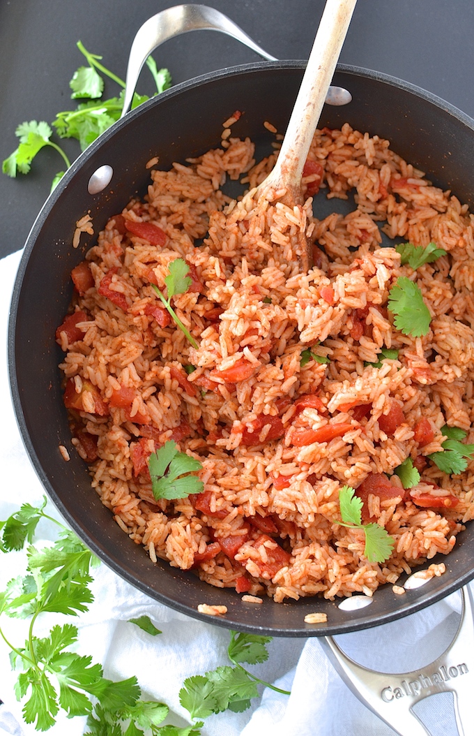 Simple Spanish Rice - Flavored with simple spices and tomatoes, this Simple Spanish Rice recipe is a perfect side dish for any dinner. ~sweetpeasandabcs.com