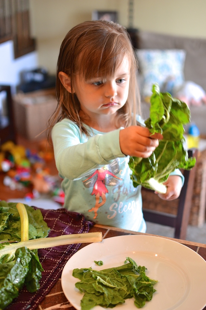 Tearing swiss chard leaves to make Pasta with Greens and Balsamic Tomatoes ~sweetpeasandabcs.com