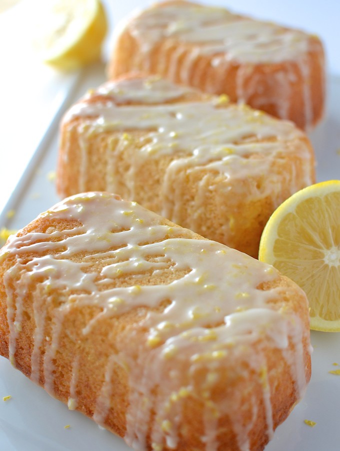 Little Lemon Loaves - This recipe for soft and sweet lemon tea bread is topped with a sugary lemon glaze