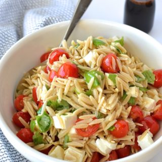 Caprese Orzo Salad with Balsamic Syrup - Fresh mozzarella, juicy tomatoes, garden basil and orzo pasta drizzled with a sweet balsamic syrup...perfect for a weekday lunch or as a side at your summer BBQ! ~sweetpeasandabcs.com