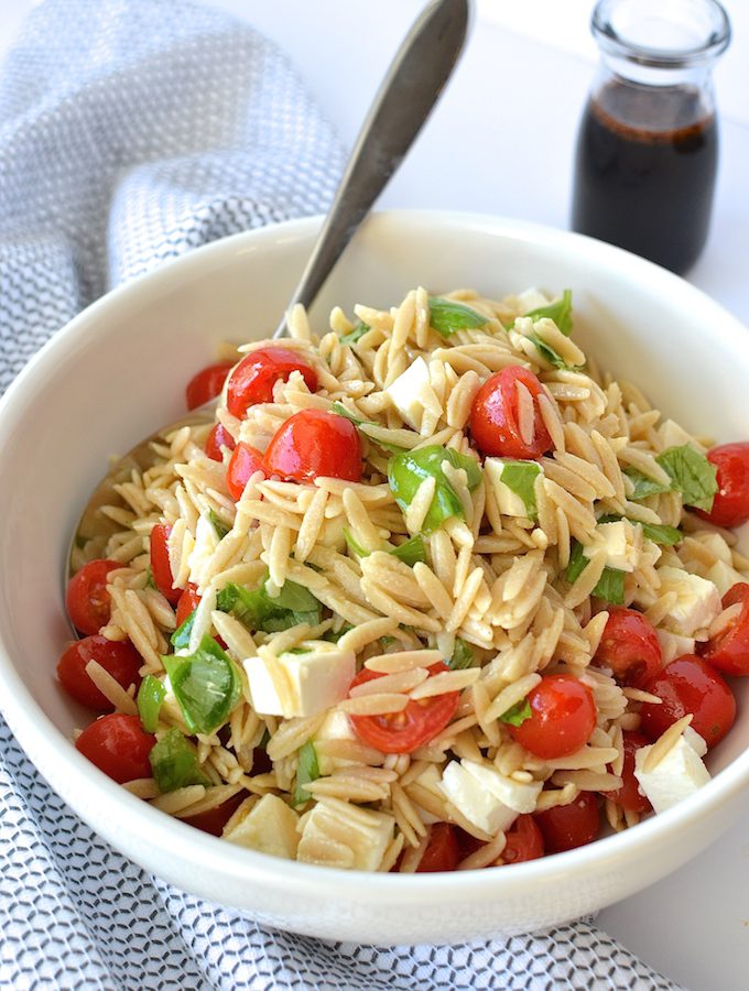 Caprese Orzo Salad with Balsamic Syrup - Fresh mozzarella, juicy tomatoes, garden basil and orzo pasta drizzled with a sweet balsamic syrup...perfect for a weekday lunch or as a side at your summer BBQ! ~sweetpeasandabcs.com