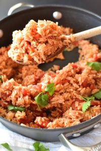 Simple Spanish Rice - Flavored with simple spices and tomatoes, this Simple Spanish Rice recipe is a perfect side dish for any dinner. ~sweetpeasandabcs.com