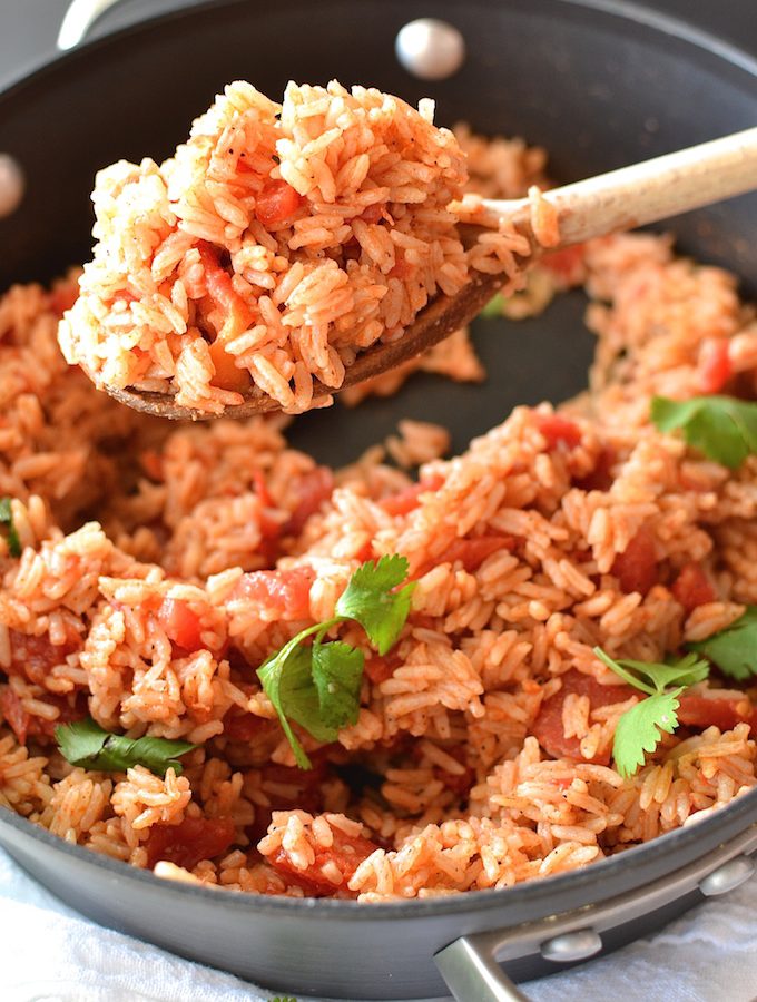 Simple Spanish Rice - Flavored with simple spices and tomatoes, this Simple Spanish Rice recipe is a perfect side dish for any dinner. ~sweetpeasandabcs.com